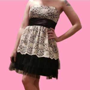S Black lined dress with tulle and white lace overlay built in satin ribbon belt